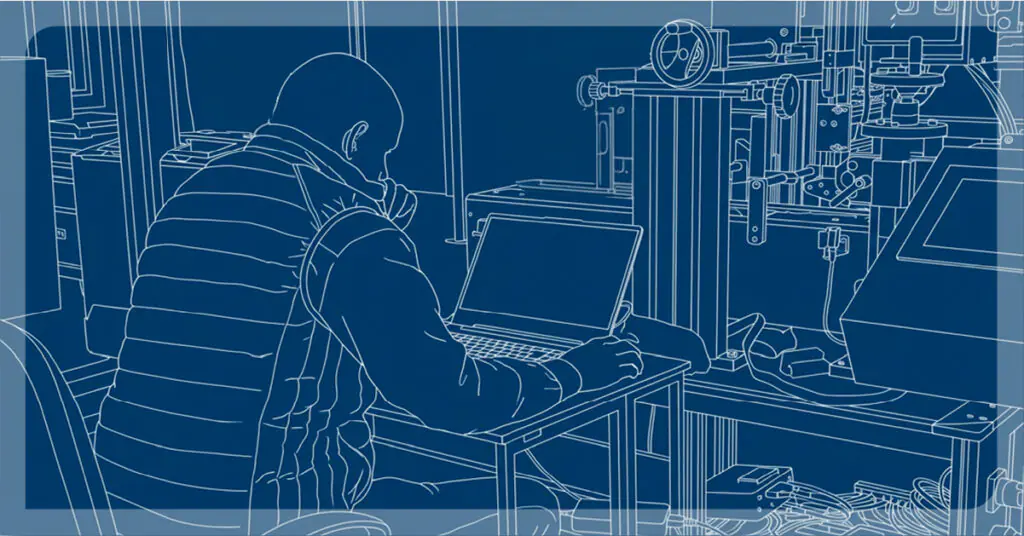 Ingeniero de Etima diseñando maquinaria de etiquetado con software CAD en la oficina técnica